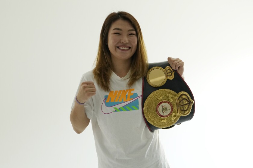 WBA woman super featherweight champion Choi Hyunmi poses for photos during an interview in Seoul, South Korea, on June 21, 2021. South Korea’s only boxing world champion is Choi, a North Korean defector who fled her authoritarian homeland as a 13-year-old girl with her family in 2003. (AP Photo/Ahn Young-joon)