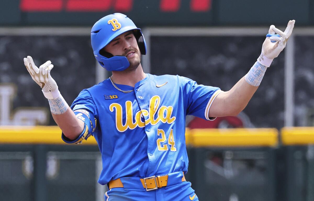 UCLA's AJ Salgado celebrates after hitting a two-run double in the fourth inning.