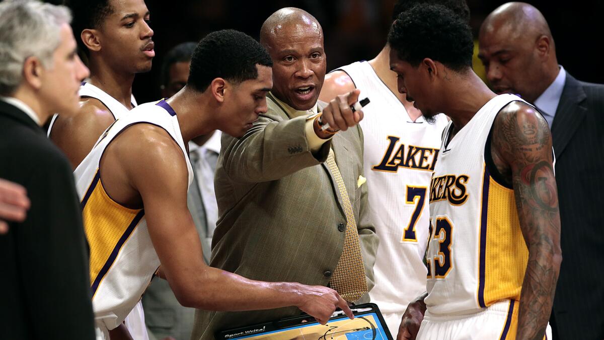 Lakers Coach Byron Scott instructs players on how to approch the last minute against the Jazz when trailing by 10 points during a game on Jan. 10.