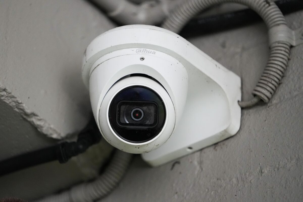 This shows a Chinese Dahua brand security camera in Sydney, Australia, Thursday, Feb. 9, 2023. Australia's Defense Department said Thursday that they will remove surveillance cameras made by Chinese Communist Party-linked companies from its buildings. (AP Photo/Mark Baker)
