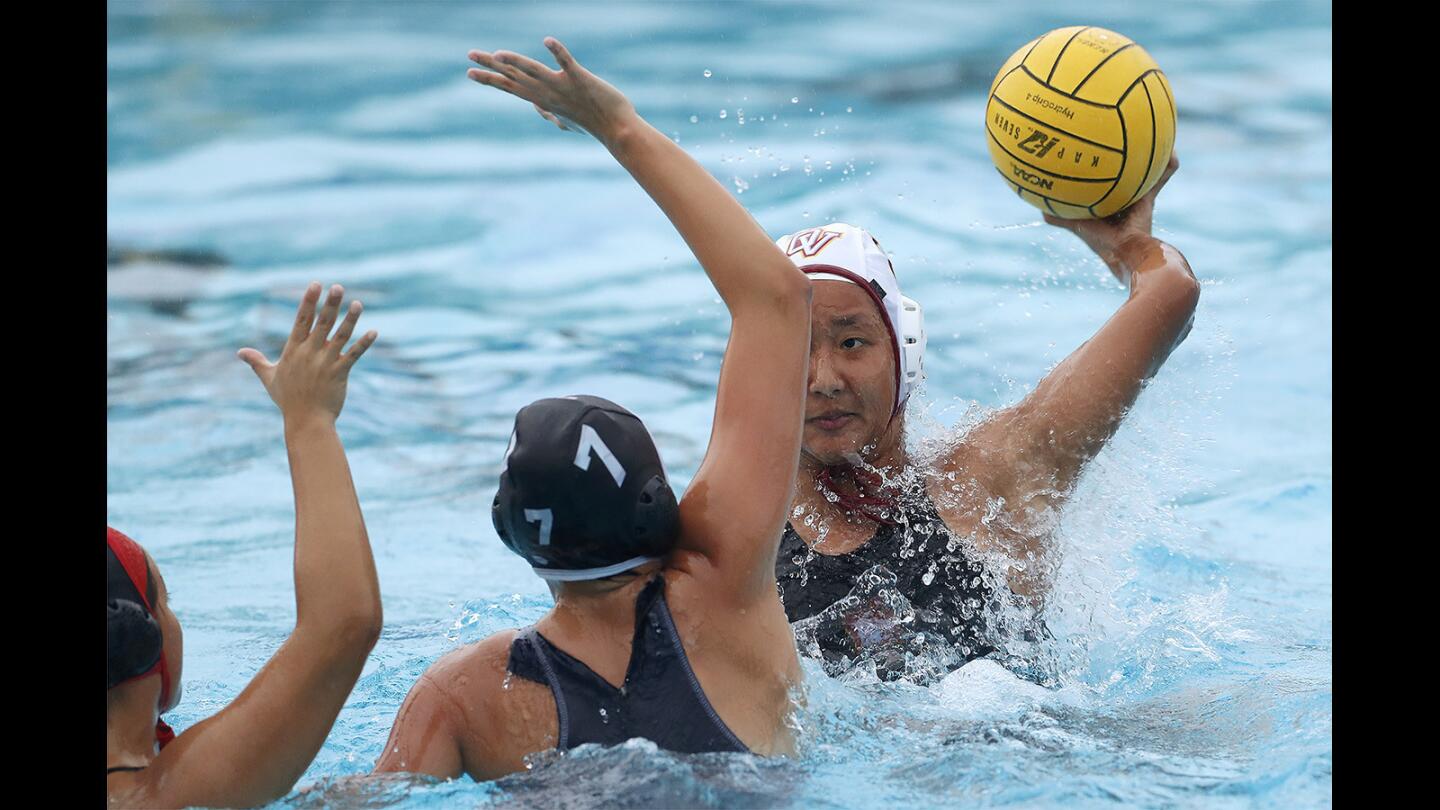 Ocean View's Leyna Tran looks for an open shot against Segerstrom's Liz Fuentes, left, and Faith Cueva, center, during a game on Tuesday, January 9.
