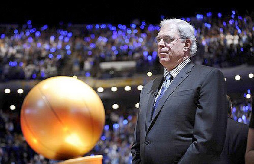 Phil Jackson with the NBA championship trophy.