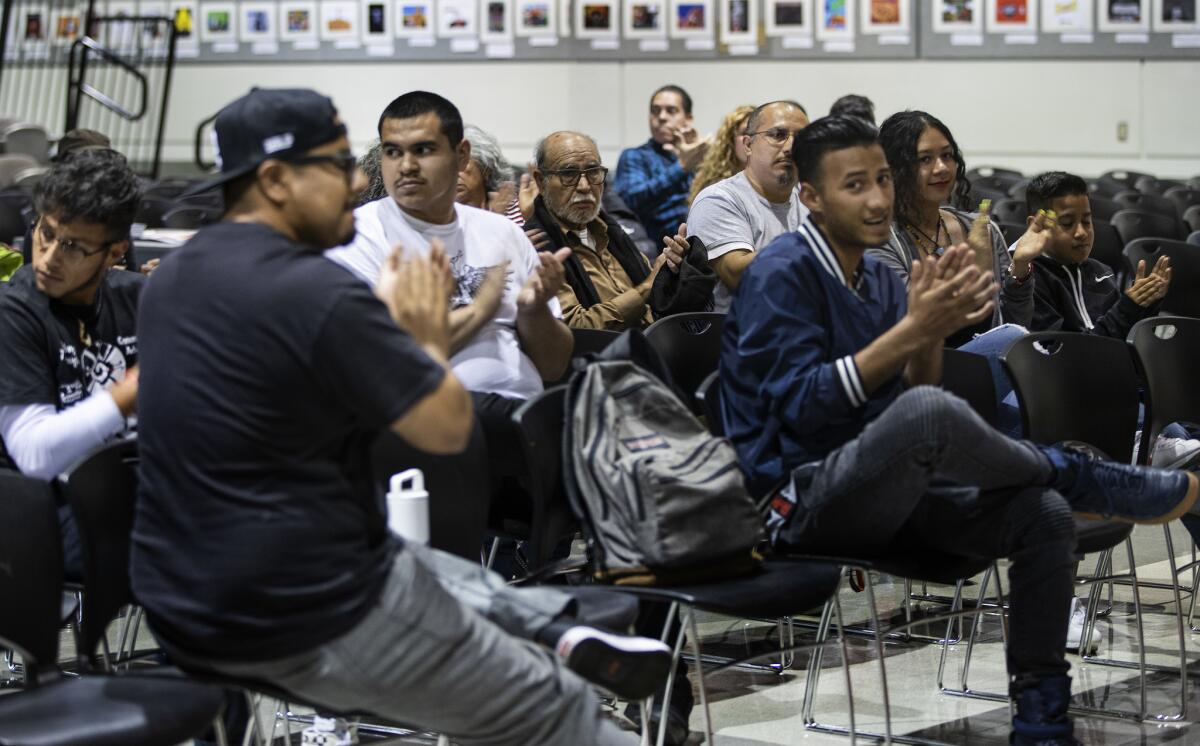 Young and older members of the Latino student group MEChA gather to discuss the future of the organization at Dr. Maya Angelou Community High School on May 24 in Los Angeles.