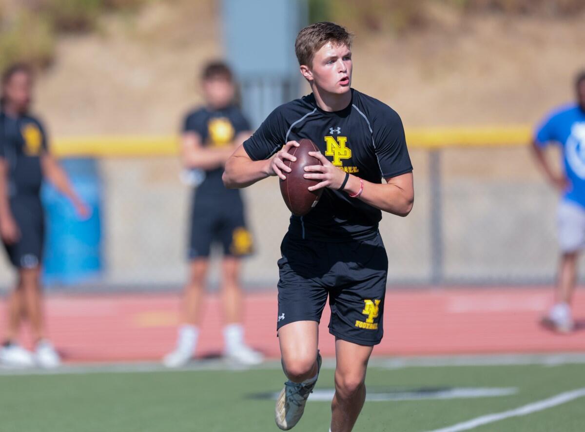 Newbury Park's Brady Smigiel runs on the football field.