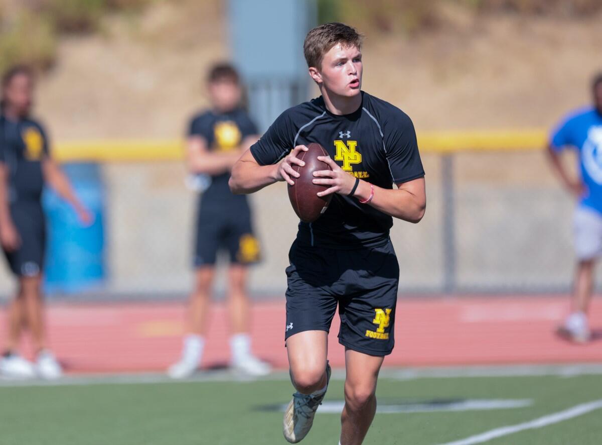 Newbury Park's Brady Smigiel runs on the football field.