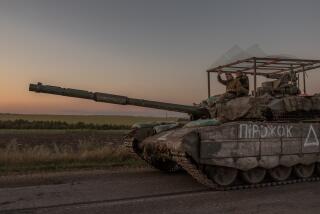 TOPSHOT - Ukrainian servicemen operate a tank on a road near the border with Russia, in the Sumy region of Ukraine, on August 14, 2024. The Ukrainian army entered Russia's Kursk region on August 6, capturing dozens of settlements in the biggest offensive by a foreign army on Russian soil since World War II. (Photo by Roman PILIPEY / AFP) (Photo by ROMAN PILIPEY/AFP via Getty Images)