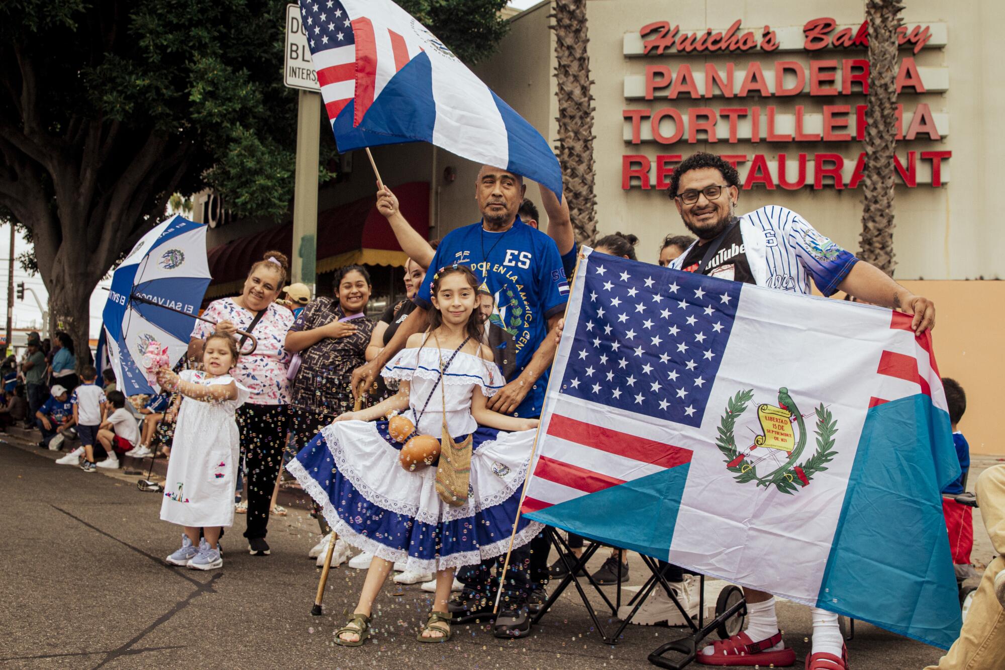A family holding flags