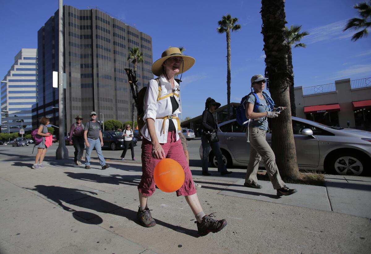 Sierra Club members are 13 miles into their annual 16-mile walk from Wilshire Boulevard and Figueroa Street in downtown Los Angeles to Ocean Avenue in Santa Monica.