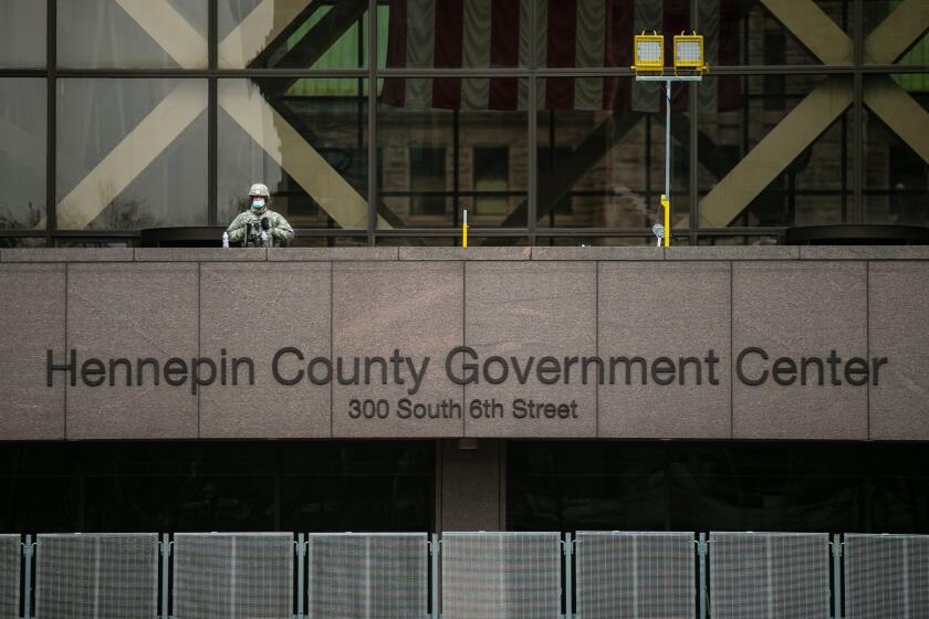 MINNEAPOLIS, MN - APRIL 19: National Guard secure the Hennepin County Government Center during closing arguments in the Derek Chauvin trial on Monday, April 19, 2021 in Minneapolis, MN. (Jason Armond / Los Angeles Times)