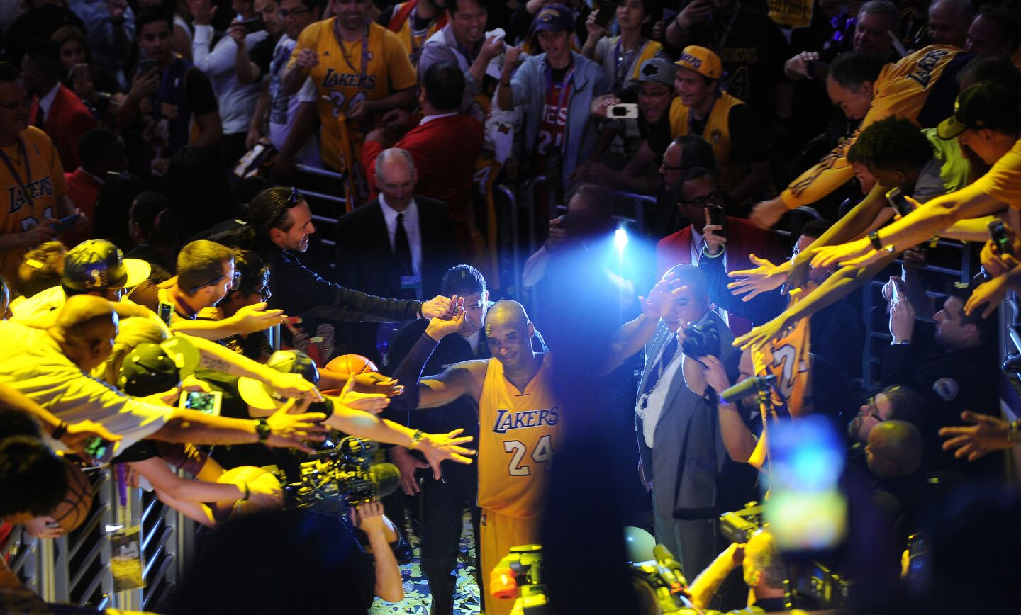 Kobe Bryant walks off the court after his final game at Staples Center.