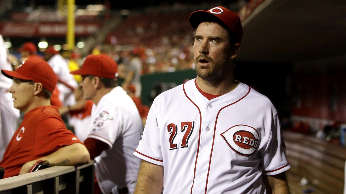 Reds reliever Ross Ohlendorf (27) walks through the dugout on the way to the clubhouse after being ejected from a game against Pittsburgh on Wednesday.