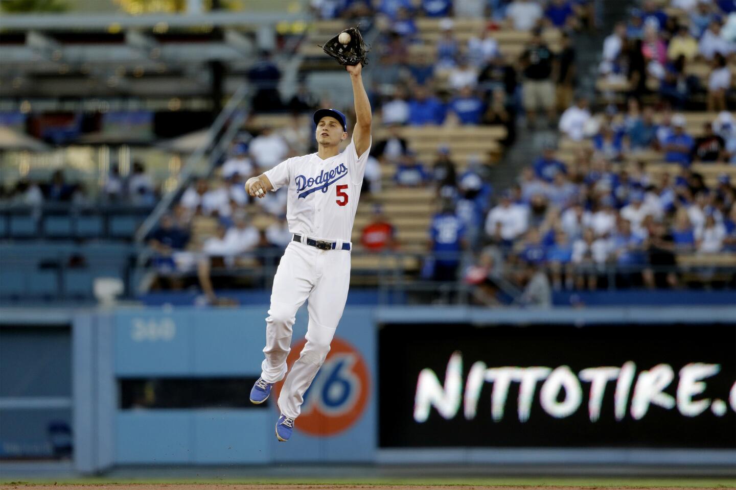 Dodgers shortstop Corey Seage leaps to catch a line drive against the Giants in the first inning.