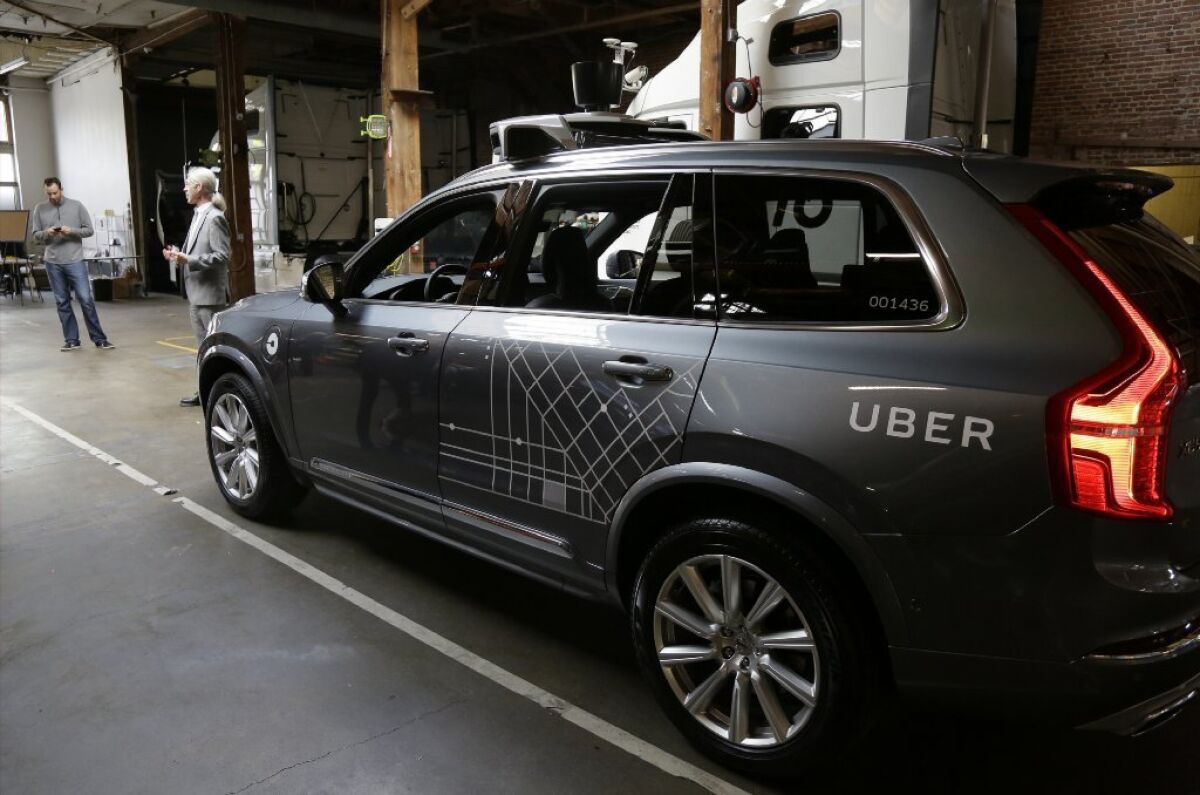 An Uber self-driving car is displayed in a garage in San Francisco.