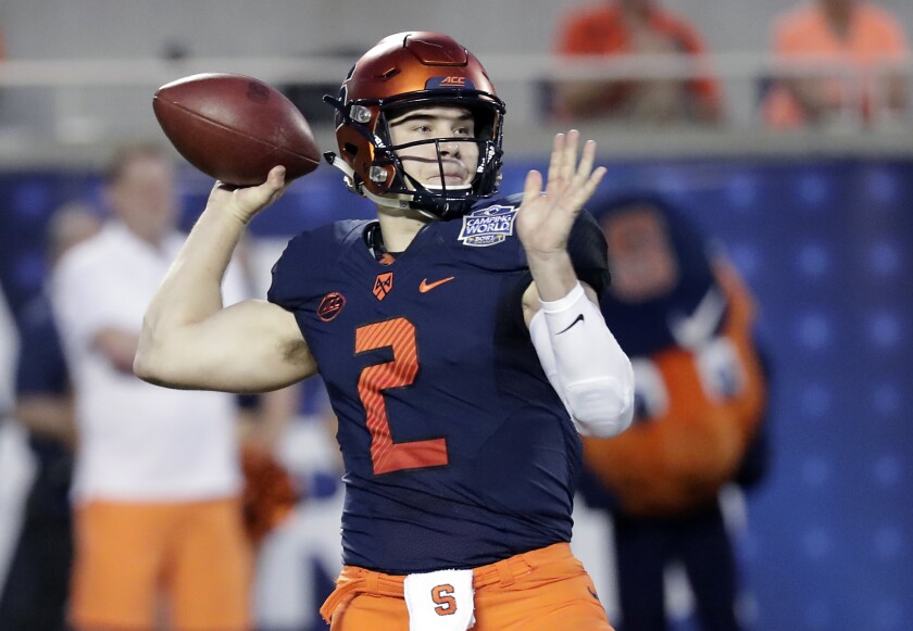 FILE - In this Dec. 28, 2018, file photo, Syracuse quarterback Eric Dungey throws a pass against West Virginia during the first half of the Camping World Bowl NCAA college football game in Orlando, Fla. Still hoping to get a chance at playing professionally, Dungey has been invited to Cincinnati Bengals minicamp. (AP Photo/John Raoux, File)