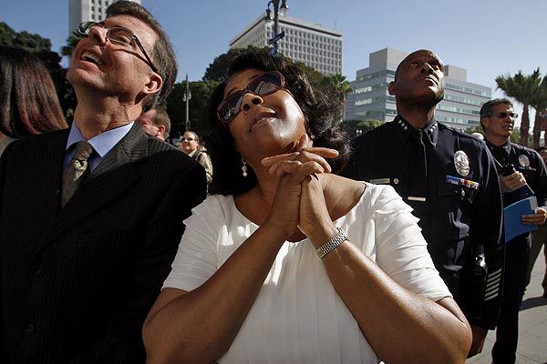 L.A. City Councilwoman Jan Perry, center, gazes up at the scene. The building is 10 stories tall, and the headquarters complex includes a cafe and a 400-seat civic auditorium.