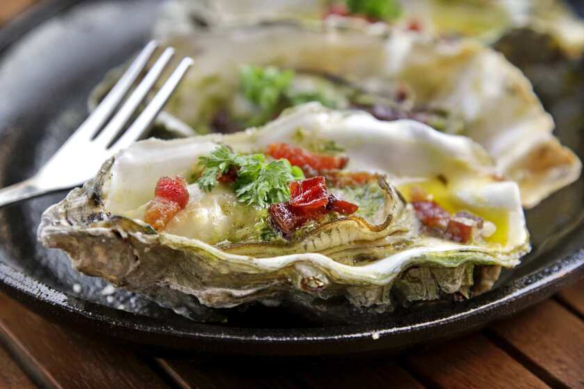 Casino oysters with butter, paprika, thyme, shallots and neuske's bacon, served at L&E Oyster Bar, on Silver Lake Blvd.