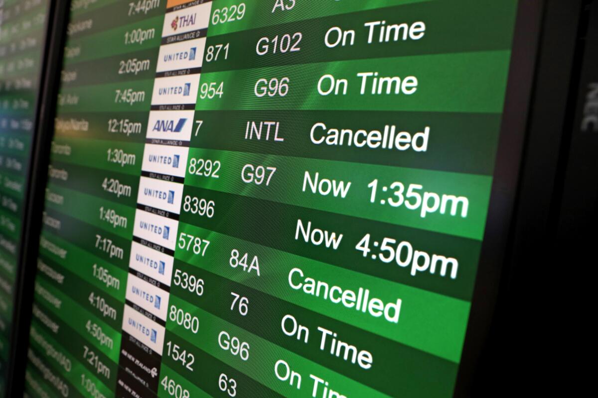 A flight board at SFO.