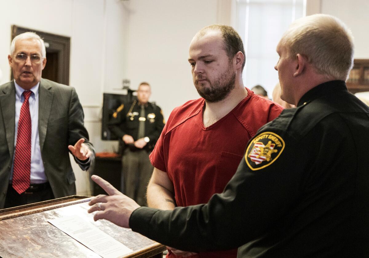 FILE - George Wagner IV, center, is escorted out of the courtroom after his arraignment on Nov. 28, 2018, at the Pike County Courthouse, in Waverly, Ohio. Opening statements are expected Monday, Sept. 12, 2022, in the death penalty trial of Wagner, indicted for his role in the death of eight Ohio family members. (Robert McGraw/The Chillicothe Gazette via AP, Pool, File)