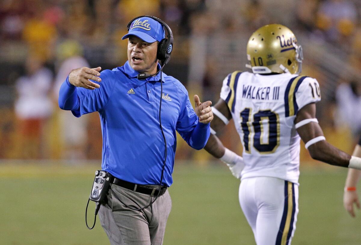 UCLA Coach Jim Mora shouts instructions to his players during a game against Arizona State on Oct. 8.