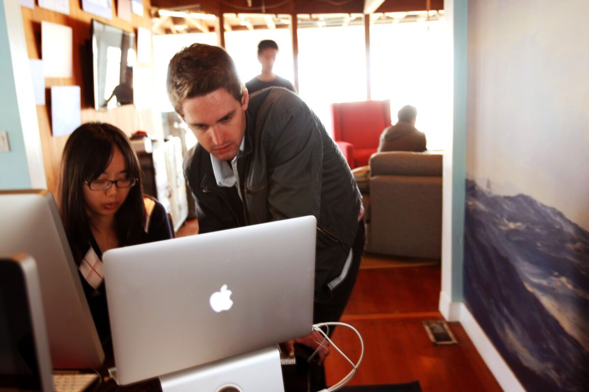 Evan Spiegel works with Chia-Yi Lin at Snap's offices in Venice in 2013. (Genaro Molina / Los Angeles Times)