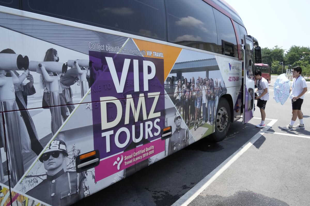 Advertisement on side of bus for tours of Korean DMZ