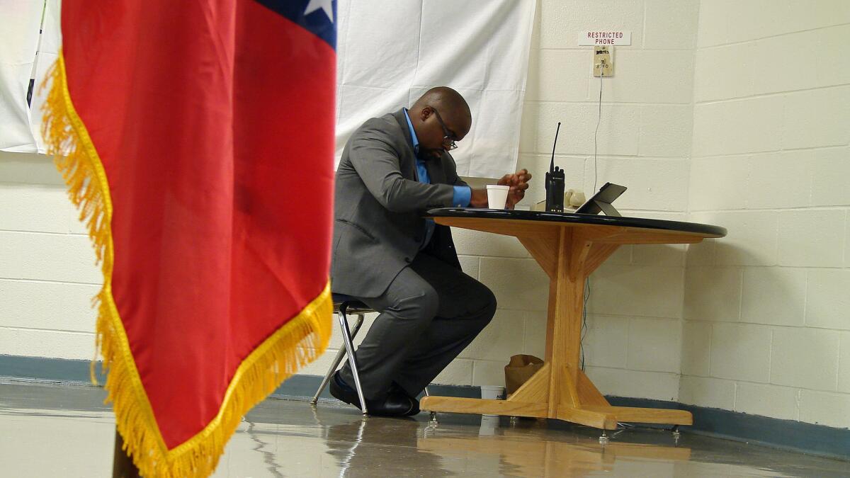 Arkansas Department of Corrections spokesperson Solomon Graves awaits news from the death chamber.