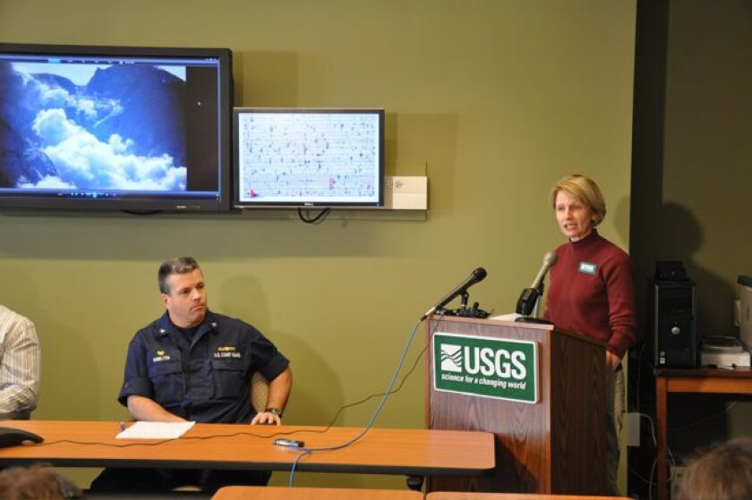 Margaret Mangan, on detail with the USGS Alaska Volcano Observatory, gives a media briefing during a 2009 eruption of Redoubt volcano in Alaska.