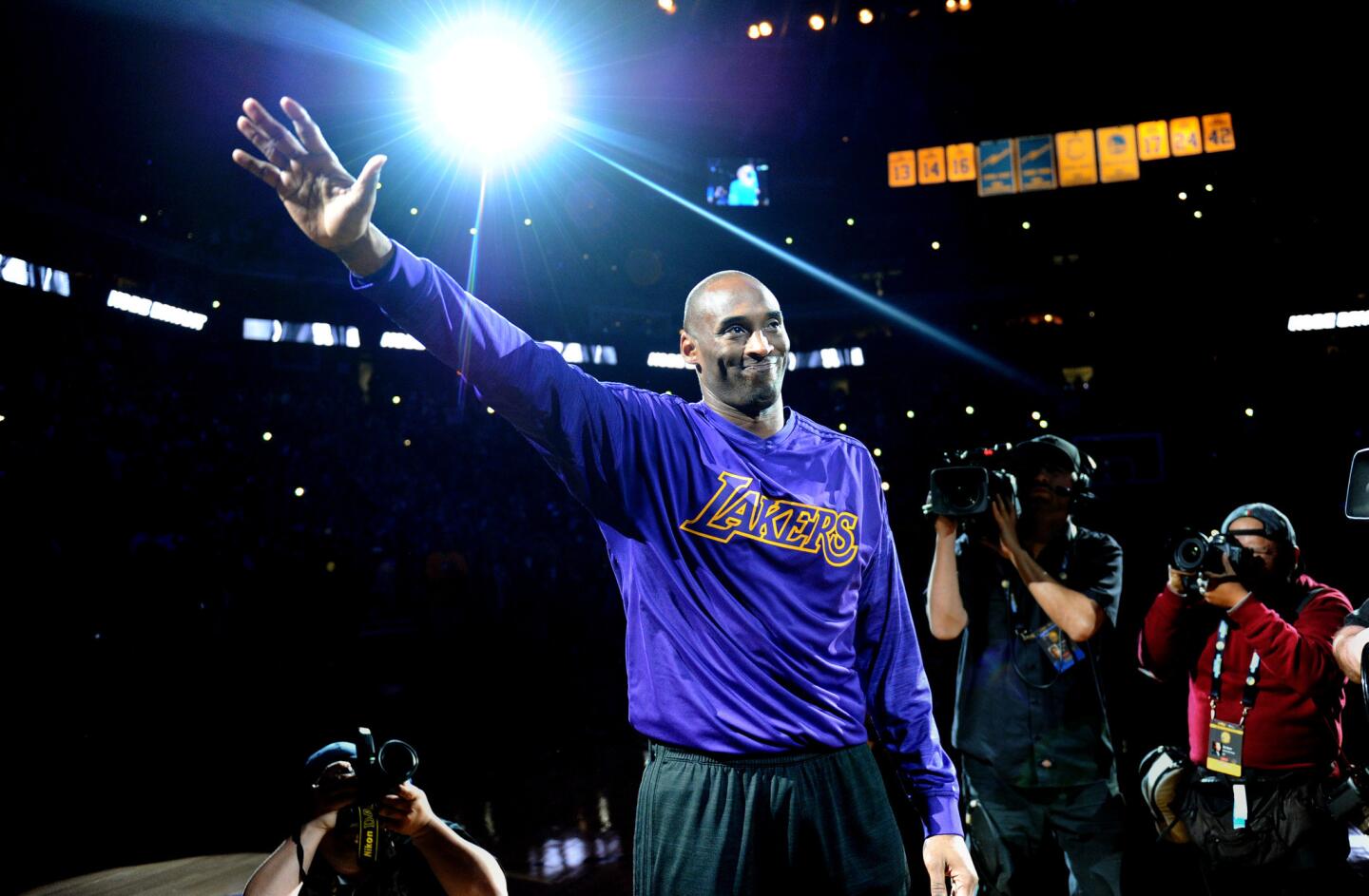 Kobe Bryant waves to the crowd at Oracle Arena while being introduced before the Lakers playedthe Warriors on Jan. 14, 2016.
