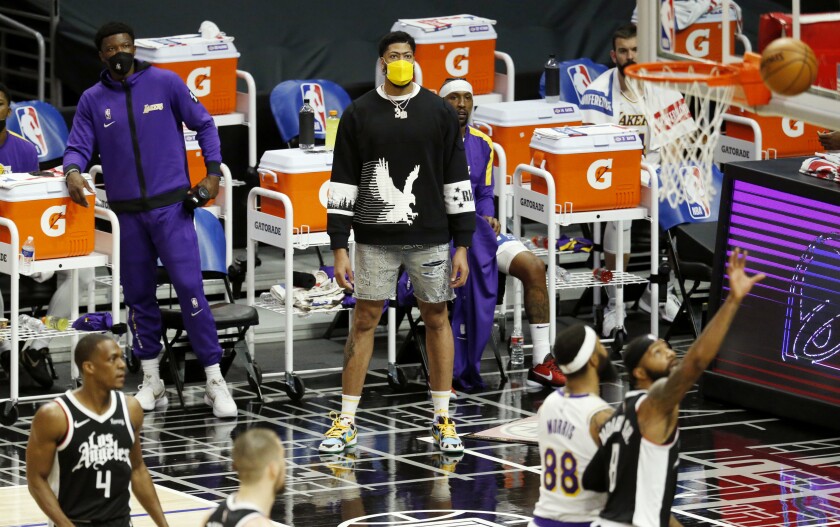 Injured forward Anthony Davis watches the Lakers play the Clippers from the sideline.