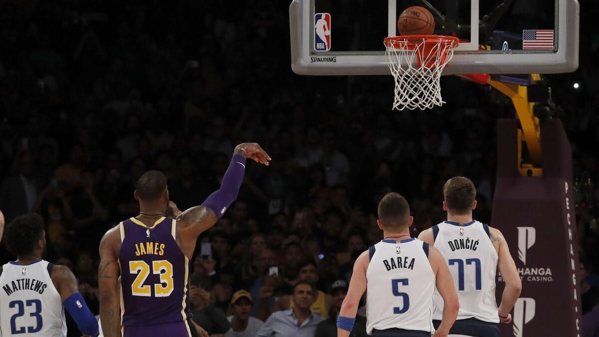 Lakers' LeBron James sinks the second of two free throws to put the Lakers up, 114-113, against the Mavericks with about three seconds left to play in the game on Oct. 31, 2018, at Staples Center.