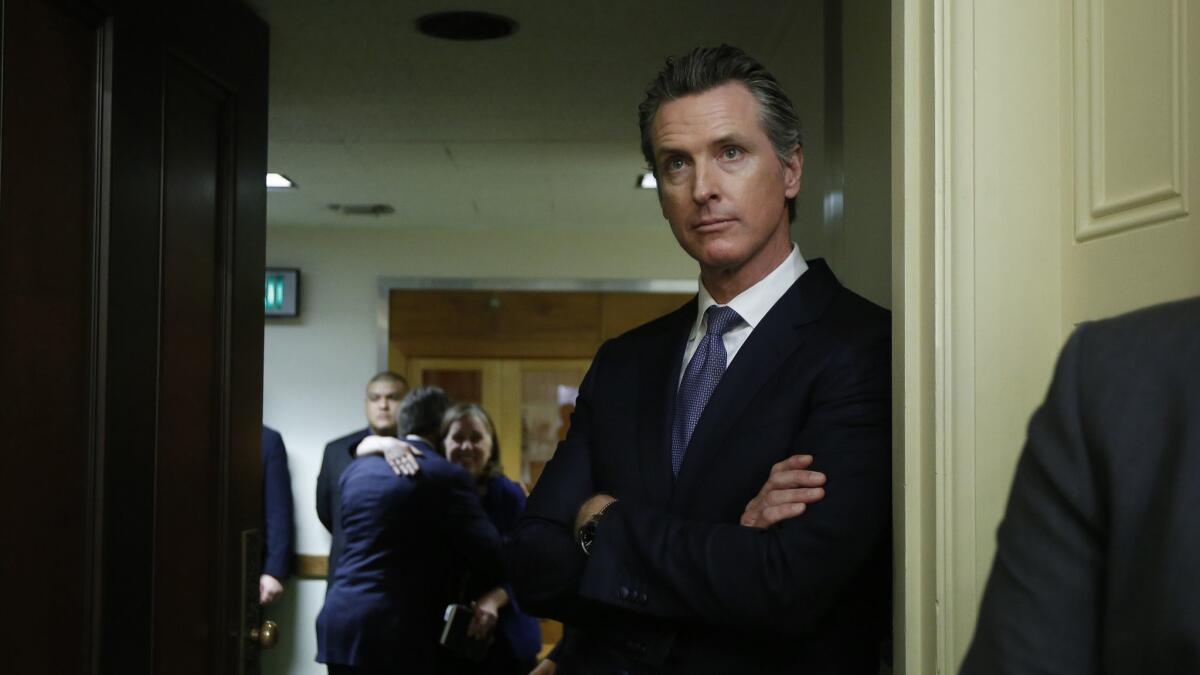 The governor-elect, Lt. Gov. Gavin Newsom, watches the Assembly session at the Capitol on Dec. 3 in Sacramento.