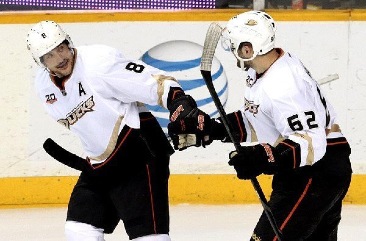 Ducks right wing Teemu Selanne (8) is congratulated by teammate Patrick Maroon after scoring the go-ahead goal against the Predators on a power play in the second period Thursday night in Nashville.