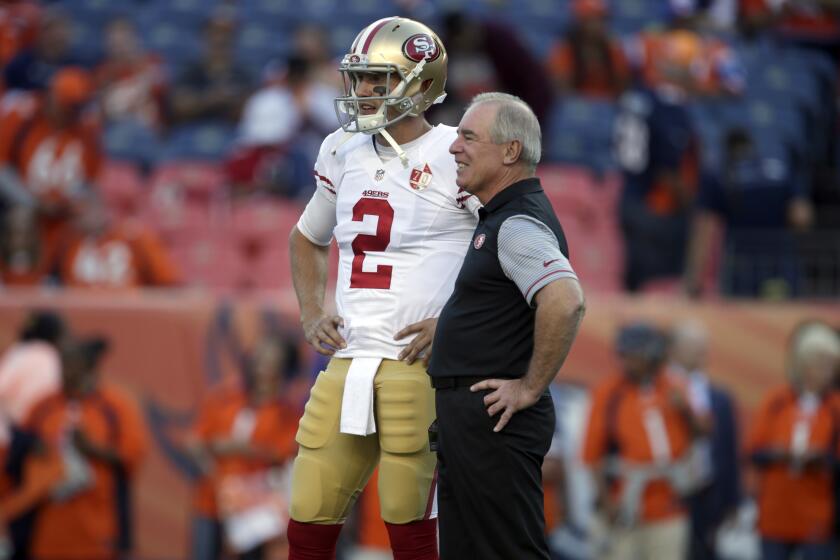 Dana Bible, then a senior advisor on San Francisco's staff, talks with quarterback Blaine Gabbert on Aug. 20, 2016.