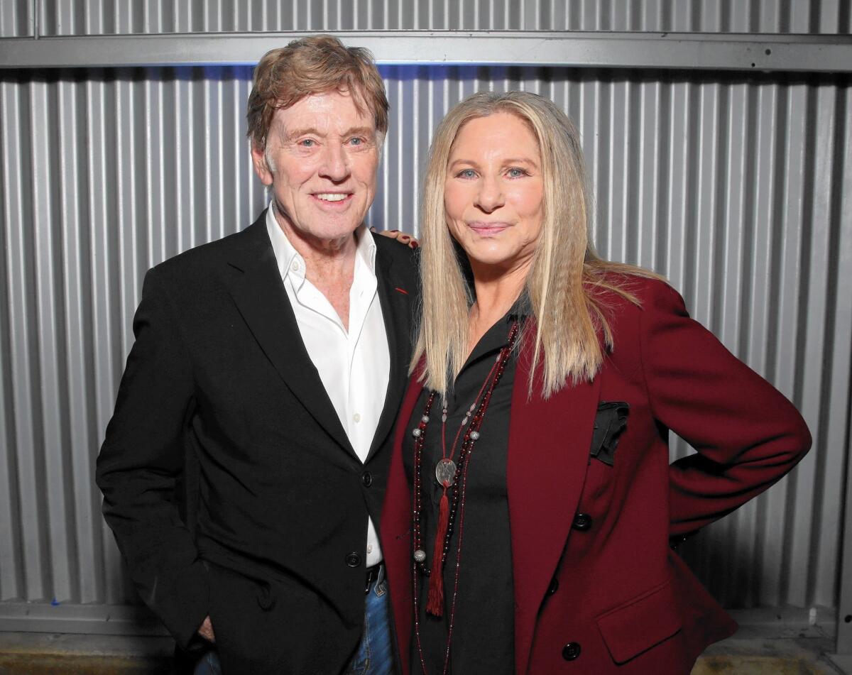 Robert Redford and honoree Barbra Streisand attend the Hollywood Reporter's Women In Entertainment Breakfast.