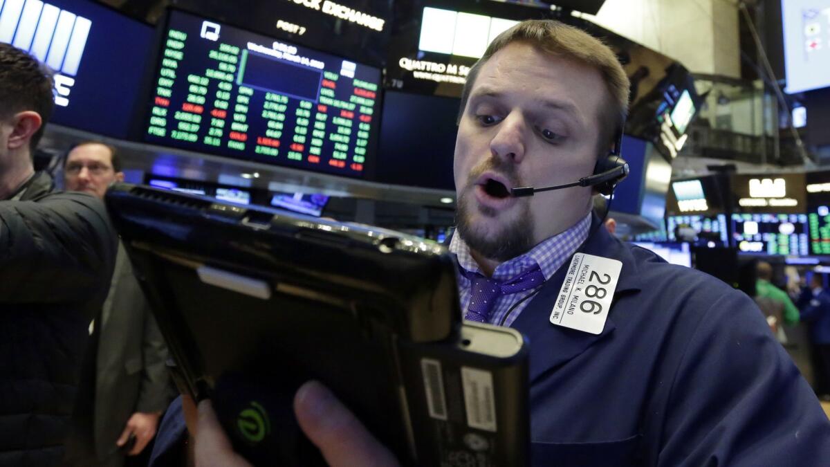 A trader works on the floor of the New York Stock Exchange.