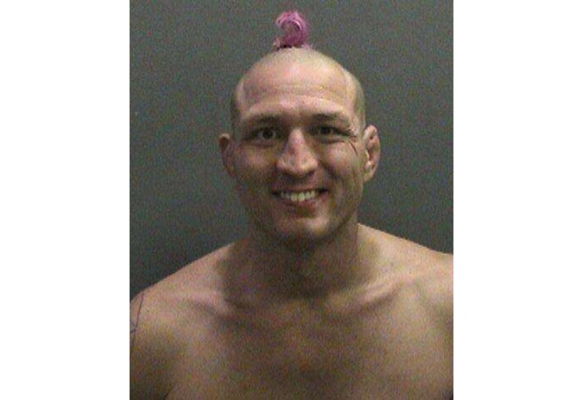 Shown is Jason "Mayhem" Miller's booking photo after an hours-long standoff with Orange County sheriff's deputies on Oct. 9, 2014.