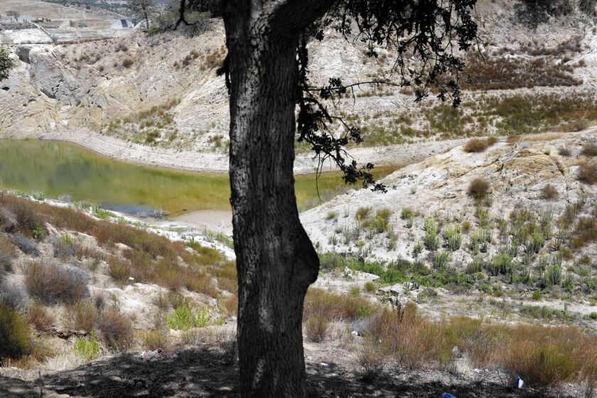 Drought has drained Lake Nacimiento, seen from a campground in July, in central California's Salinas Valley, stressing the region's groundwater basin, its only water source.