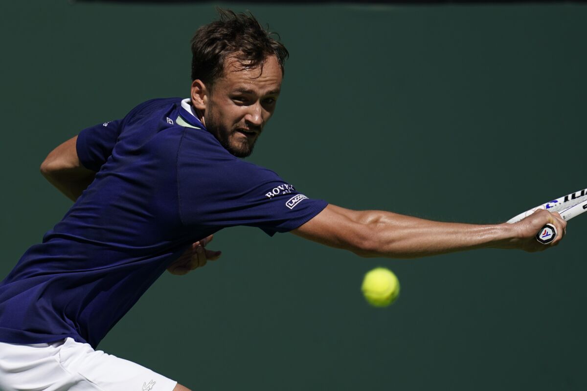Daniil Medvedev returns a shot to Gael Monfils at the BNP Paribas Open tournament.