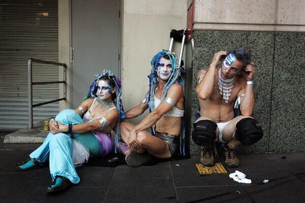 Parade goers sit in Elizabeth Street awaiting the start of the annual Sydney Gay and Lesbian Mardi Gras Parade.