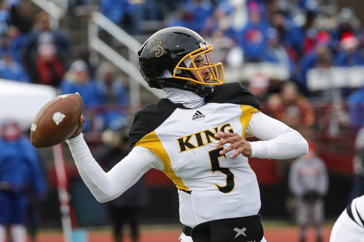 Quarterback Dante Moore of Detroit's King High looks to pass during a state playoff game Nov. 19, 2022.