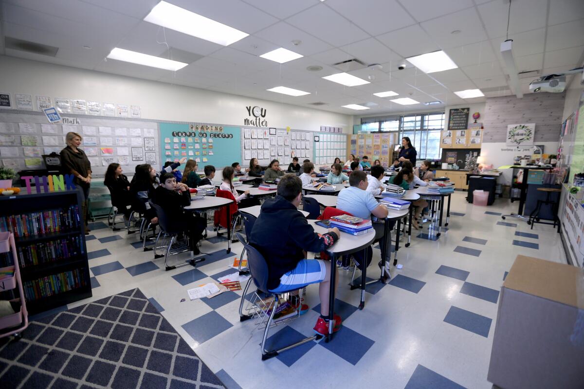 The Glendale Unified School District board is considering eventually closing down the Balboa Elementary School sixth-grade class , like the one above, and integrating those students into Toll Middle School.