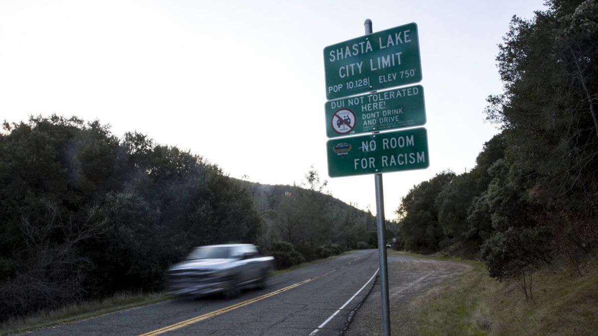 A sign on Lake Boulevard in Shasta Lake, Calif., reads "No Room for Racism." Dozens of similar signs stand throughout Shasta County in Northern California.
