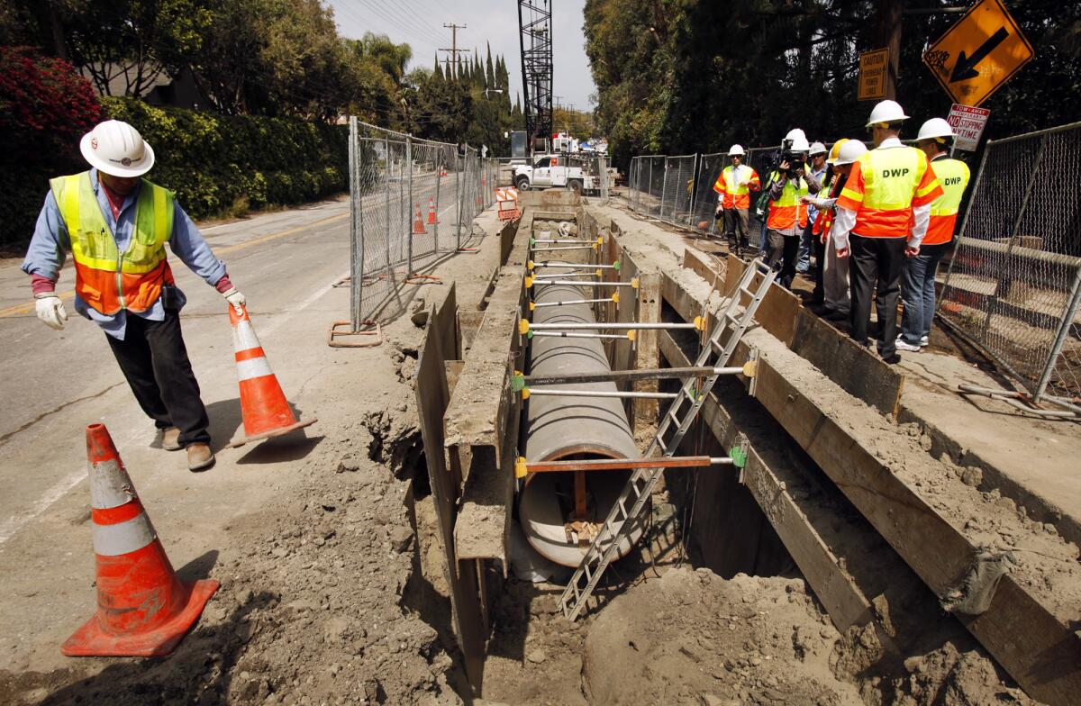 Los Angeles Department of Water and Power workers survey construction along Coldwater Canyon Boulevard in Studio City last year.
