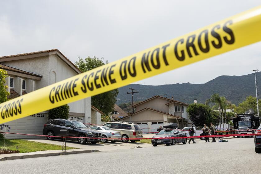 NEWBURY PARK, CA - JULY 12: Officials investigate the scene of a double-shooting at the 100 block of N. Jerome Avenue in Newbury Park, CA on Friday, July 12, 2024. (Myung J. Chun / Los Angeles Times)