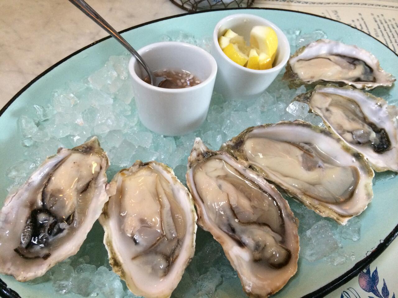Fresh oysters on the happy hour menu at Harlowe.