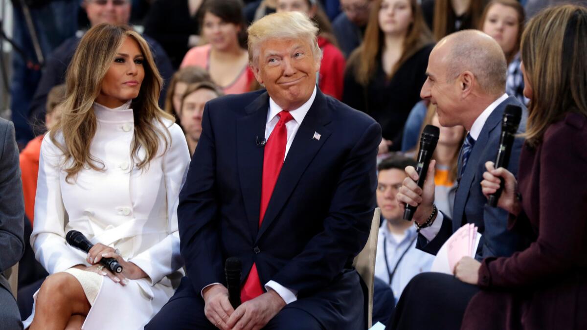 Republican presidential candidate Donald Trump and his wife Melania Trump are interviewed by co-hosts Matt Lauer and Savannah Guthrie on the NBC "Today" television program on April 21.