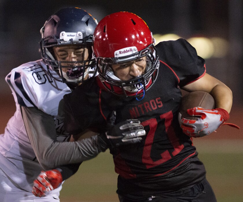 Glendale's David Ruiz is pushed out of bounds by Mendez's Efraim Mejia during Friday's game at Glendale High School.