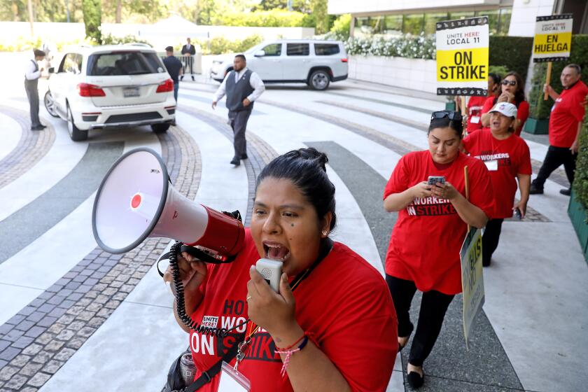 BEVERLY HILLS, CA - JULY 24: Karla Alcala, a pastry chef at the Waldorf Astoria, along with other Southern California hotel workers walk out and strike at the Waldorf Astoria on Monday, July 24, 2023 in Beverly Hills, CA. (Gary Coronado / Los Angeles Times)