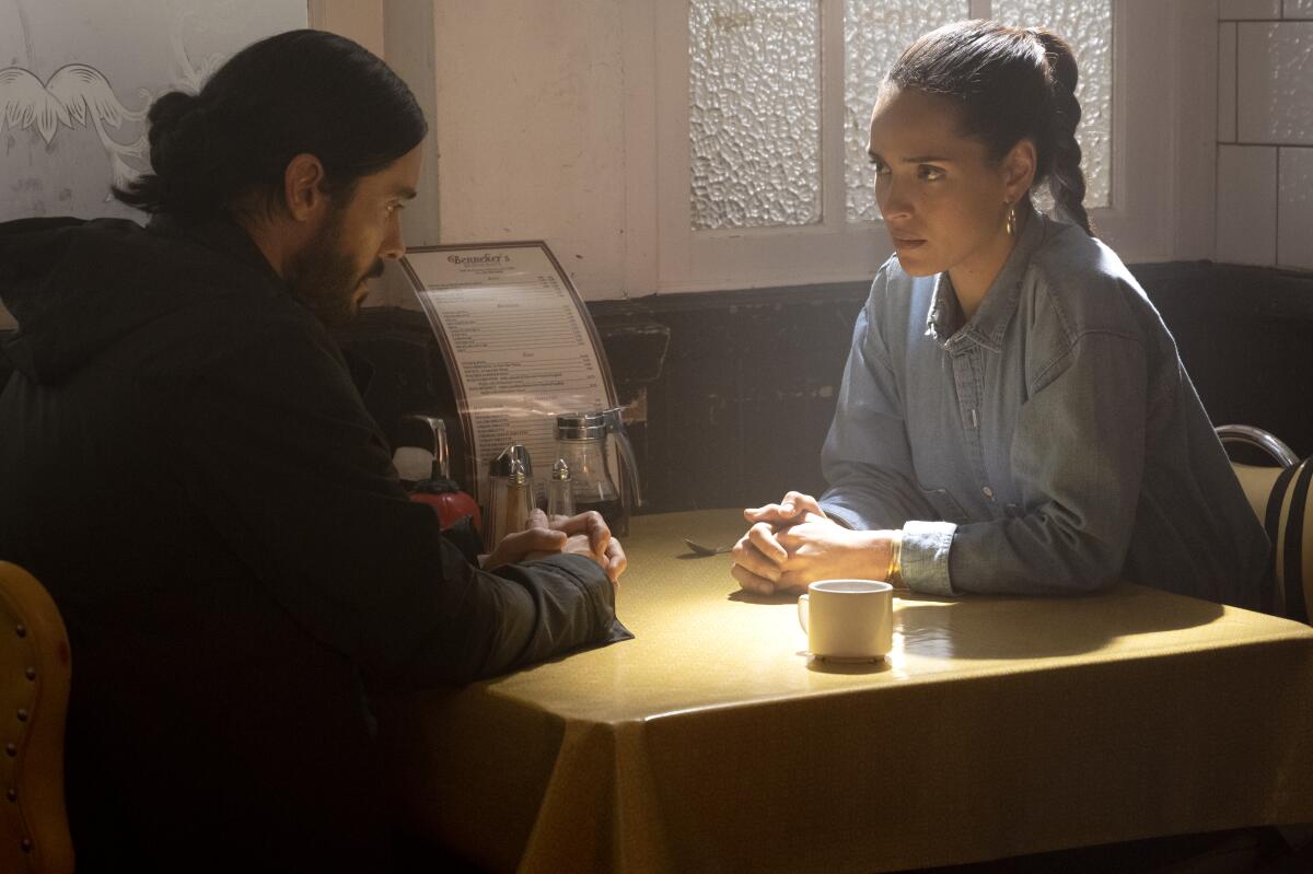 a man and a woman seated at a table 