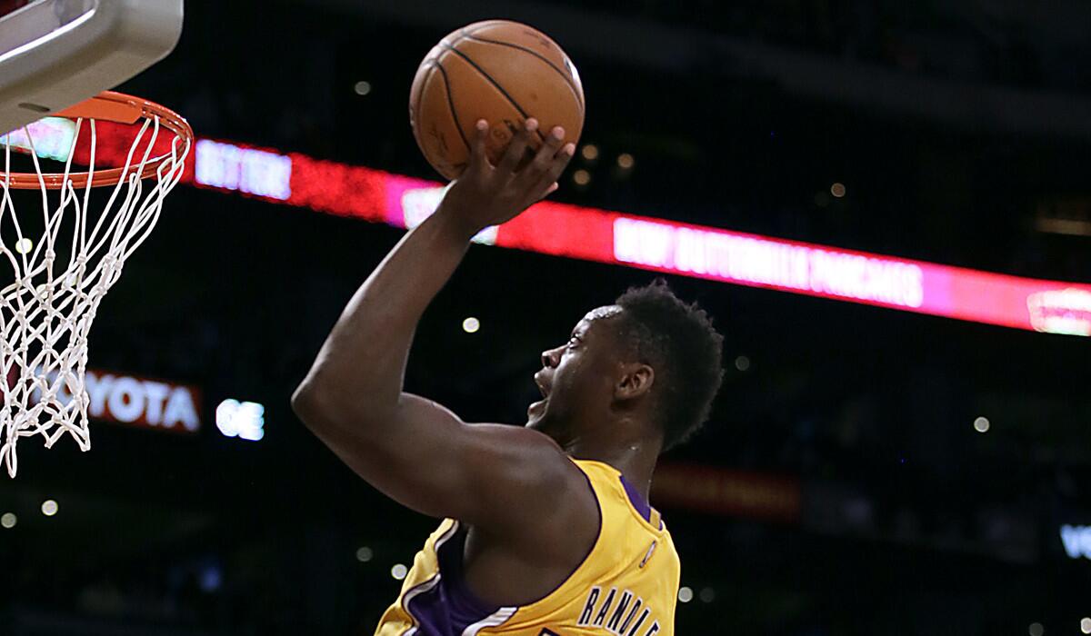 Lakers forward Julius Randle swoops in for a slam dunk during first half action at Staples Center on Tuesday.